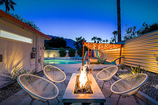 The Summit Palm Springs fire pit at twilight