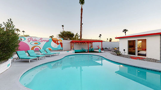 The Summit Palm Springs oversize pool with mural.