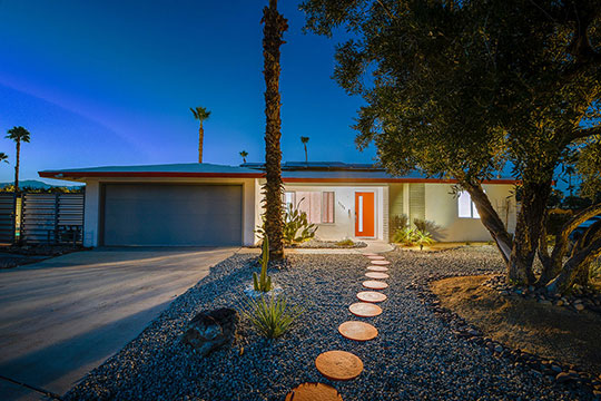 The Summit Palm Springs front yard at twilight.